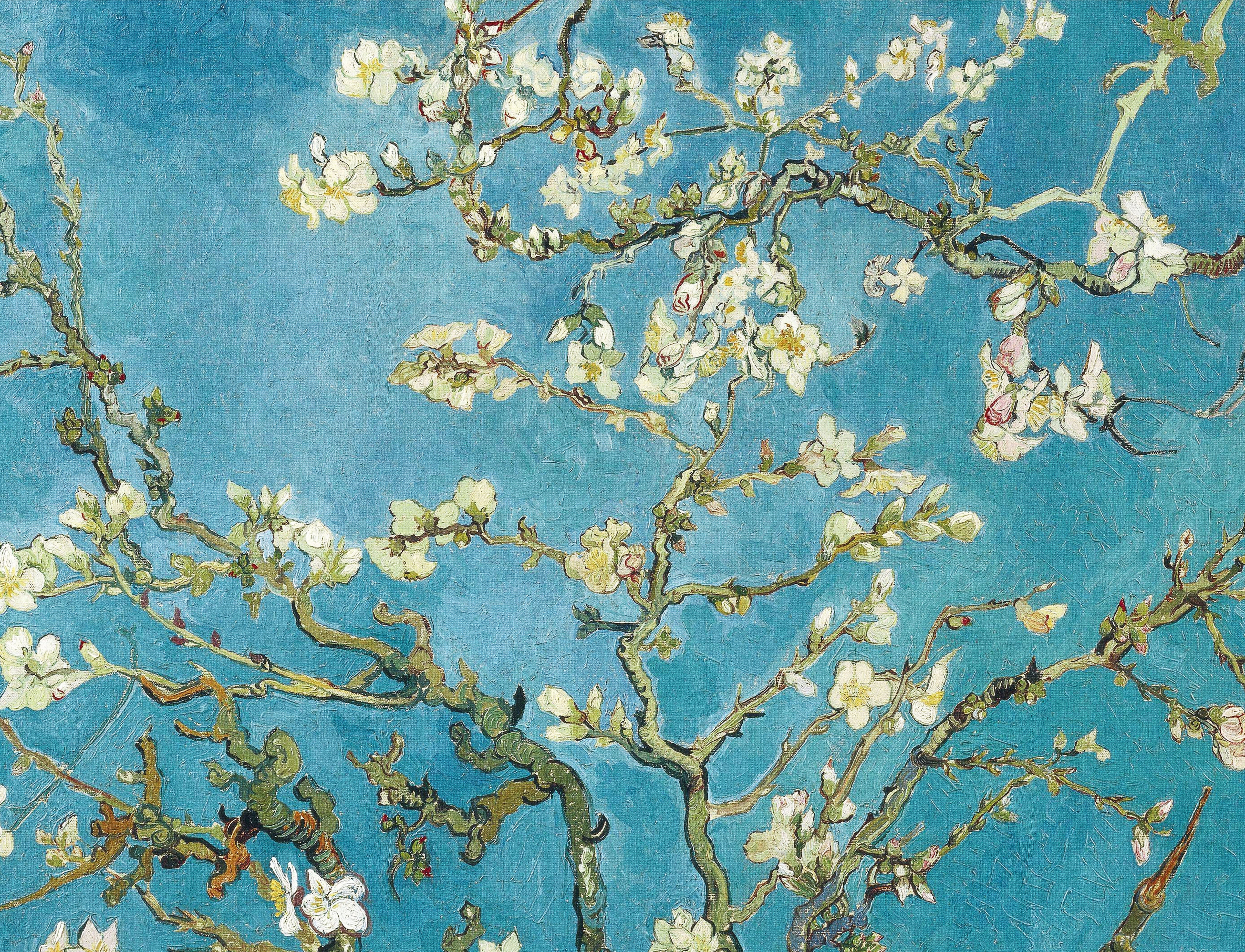 Blossoming almond tree branches against a vibrant blue background, showcasing nature's beauty and tranquility.