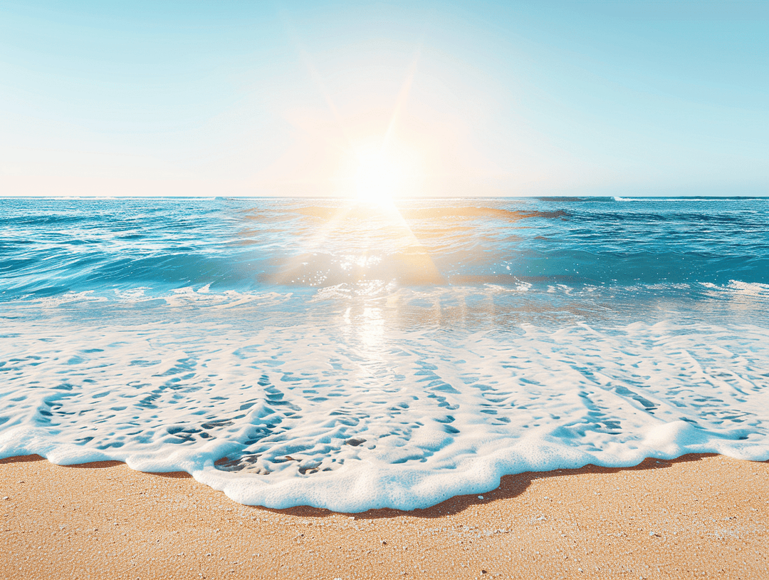 Sunrise over a tranquil ocean with gentle waves lapping at a sandy beach.