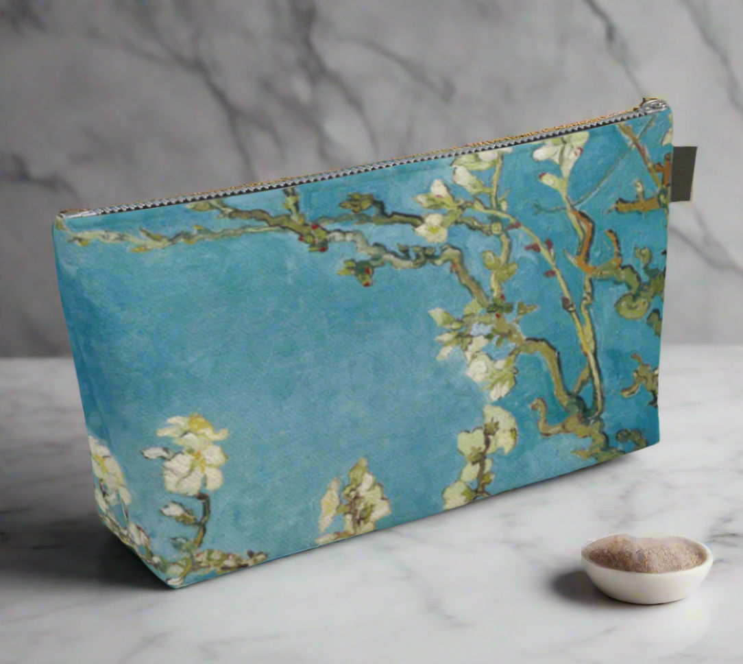 Vibrant floral pouch against a marble background, perfect for daily essentials and self-care tools.
